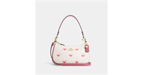 coach bag heart chain